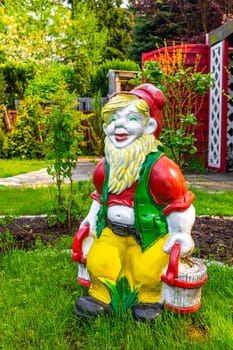 Large colorful garden gnome in the garden on the lawn in Leherheide Bremerhaven Bremen Germany.