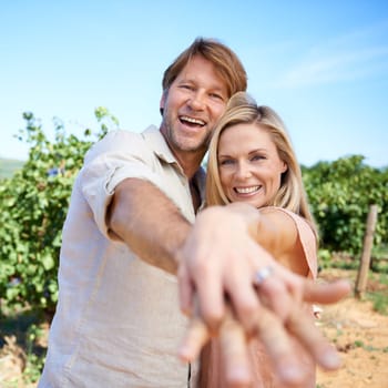 People, portrait and hands with wedding ring, happy and love in vineyard, winery and wine farm in Rome. Couple, man and woman excited for anniversary in Italy for marriage, vacation and holiday.