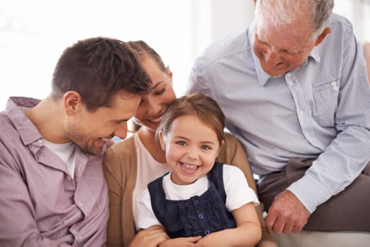 Parents, grandfather and child with portrait on sofa for healthy development, security or comfort in apartment. Family, men and woman with girl kid, smile and bonding for parenting and love in house.