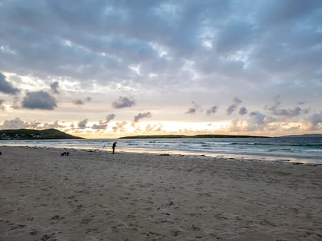 20 man are competing in a fishing competition on the beach