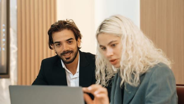 Diverse office worker employee working and brainstorm on strategic business marketing planning. Teamwork and positive attitude create productive and supportive in ornamented business office workplace.