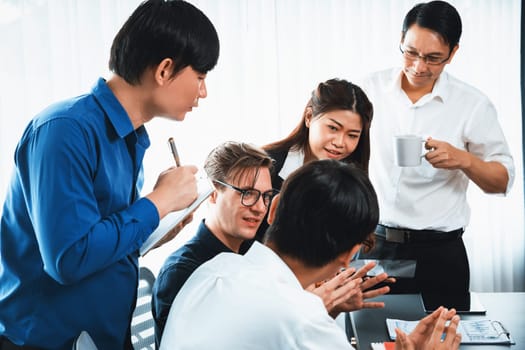 Group of diverse office worker employee working together on strategic business marketing planning in corporate office room. Positive teamwork in business workplace concept. Prudent