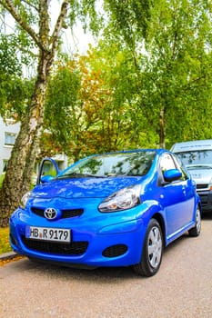 Bremerhaven Bremen Germany 22. August 2010 Small blue car vehicle parked in Leherheide Bremerhaven Bremen Germany.