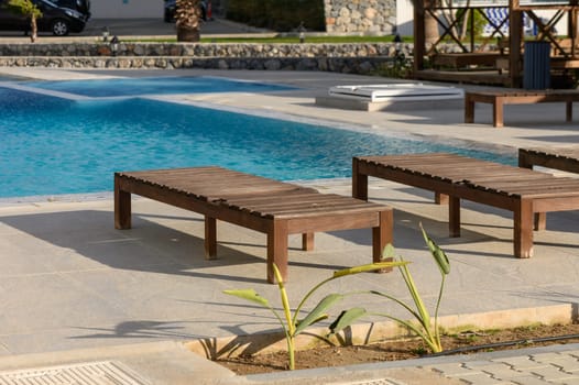 sun loungers near the cafe and pool in a residential complex