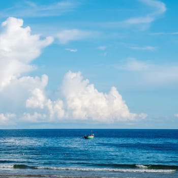 Seascape nature beauty, magic huge cumulus white clouds over blue sea, freedom happiness opportunity.