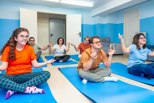 Disabled people enjoying practicing lotus pose during yoga class together