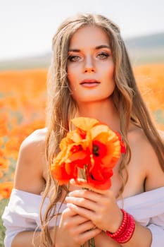 Woman poppies field. Side view of a happy woman with long hair in a poppy field and enjoying the beauty of nature in a warm summer day