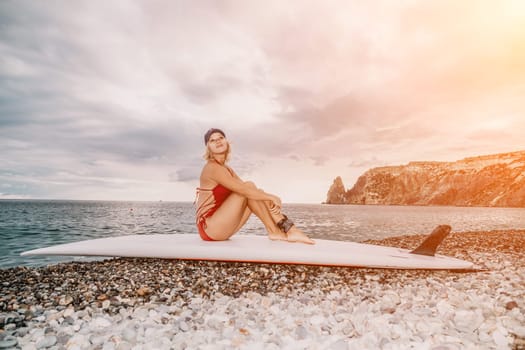 young woman in stylish bikini lying on seashore, closeup. Holiday, vacation and recreational concept.