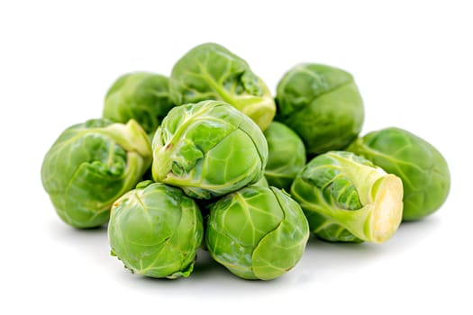 Small heap of brussels sprouts on white background. Neural network generated image. Not based on any actual scene or pattern.