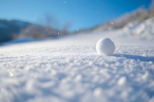 Snowball on snow covered ground at sunny winter day for snow ball effect concept. Neural network generated image. Not based on any actual scene or pattern.