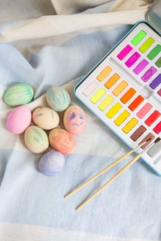 Painted colorful Easter eggs that are painted with watercolor paint. Hand-painted