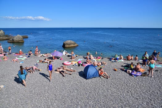 Foros, Crimea - June 30. 2019. Rocky beach with cliff in the Black Sea