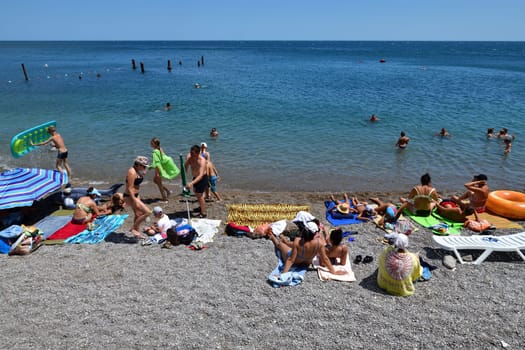 Simeiz, Crimea - July 1, 2019. Tourists relax on beach