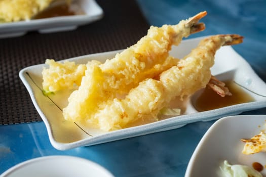 Japanese shrimps tempura recipe with ginger ponzu sauce close up