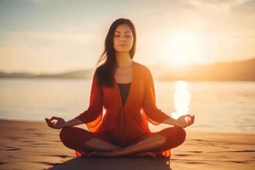 A young woman in peaceful meditation during a vibrant sunset on a tranquil beach, embodying harmony with nature.