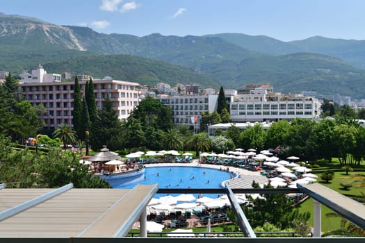 Becici, Montenegro - June 12.2019. View of pool hotel in popular resort village of Becici