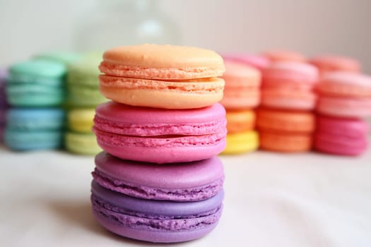 Stack of colorful macarons in soft background