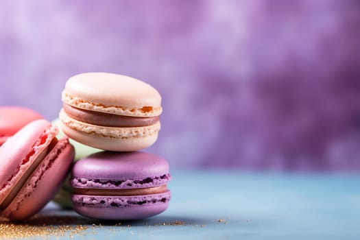 Assorted colorful macarons stacked against a purple backdrop.