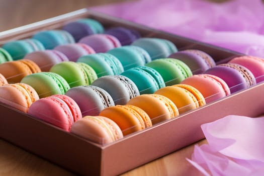 Colorful macarons in a box, sprinkles scattered around.
