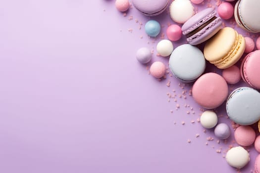 Assorted colorful macarons stacked against a purple backdrop.