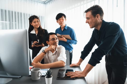 Group of diverse office worker employee working together on strategic business marketing planning in corporate office room. Positive teamwork in business workplace concept. Prudent