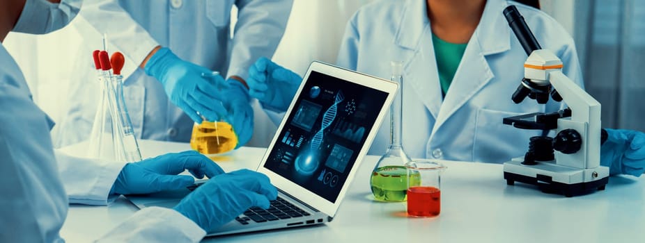 Laboratory research team advance healthcare with scientific expertise, laboratory equipment, and innovative medical biotechnology software, researching new medicines and developing cure.Panorama Rigid