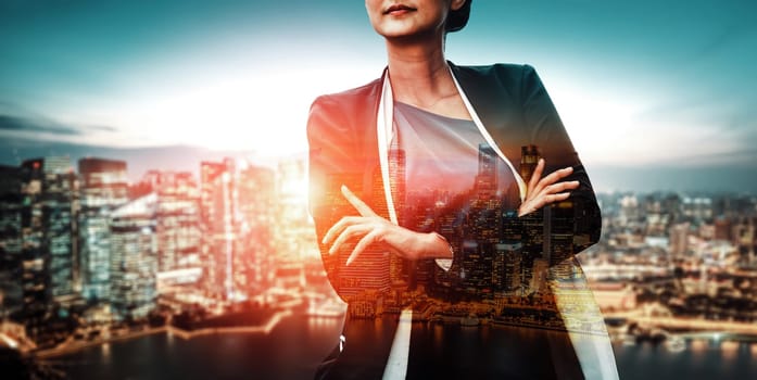 Double Exposure Image of Business Person on modern city background. Future business and communication technology concept. Surreal futuristic cityscape and abstract multiple exposure interface. uds