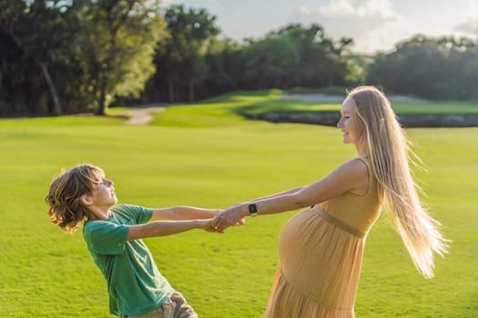 Heartwarming outdoor bonding as a pregnant mom and her son enjoy quality time together, savoring the beauty of nature and creating cherished moments.