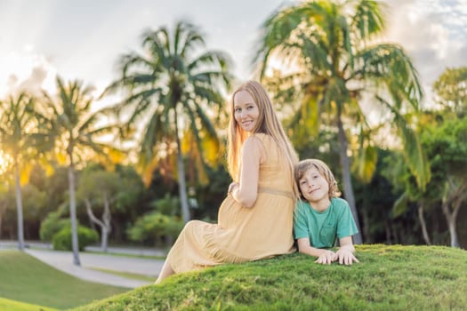 Heartwarming outdoor bonding as a pregnant mom and her son enjoy quality time together, savoring the beauty of nature and creating cherished moments.