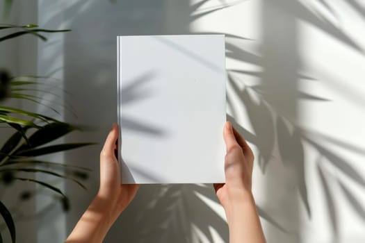 hand holding blank white book cover for mockup. isolated background . Generative AI.