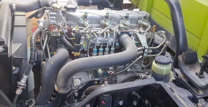 Diesel truck engine or truck engine with copy space for text. Metallic background of the internal diesel truck engine or car engine.