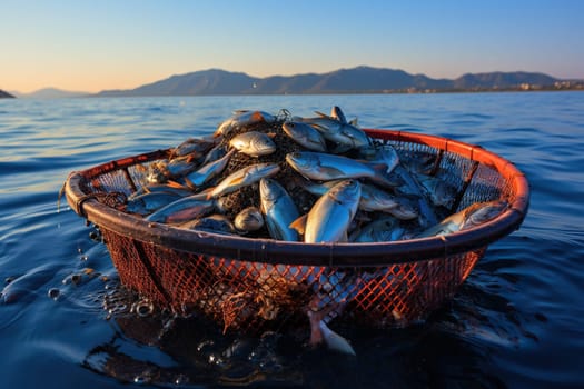 Red net full of fish in the water.