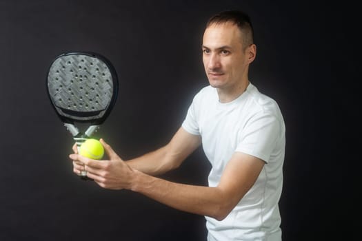 Young man playing the paddle. High quality photo
