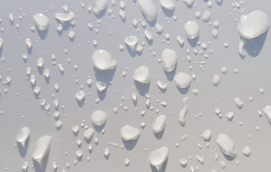 Water droplets perspective through white color surface good for multimedia content backgrounds