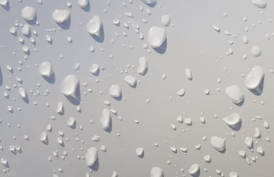 Water droplets perspective through white color surface good for multimedia content backgrounds