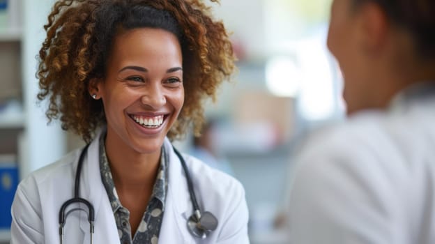 A smiling woman in a white coat talking to another person