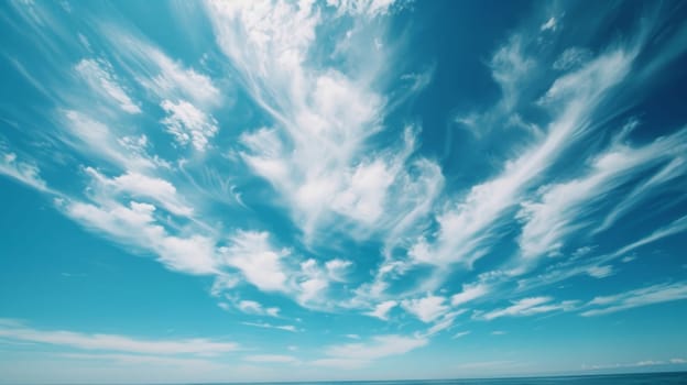 A person is sitting on a beach with the ocean in front of them