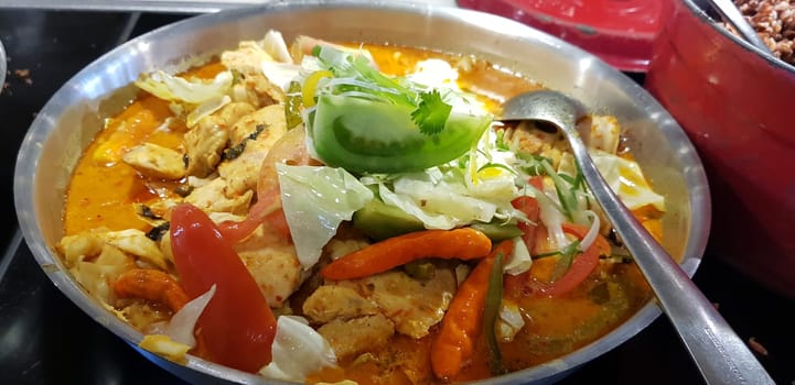 Selective focus Indonesian traditional dish mangut fish, made from smoked fish, cooked with coconut milk sauce