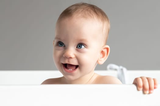 Close-up of a smiling baby approximately one to one and a half years old.