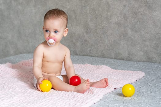 The moment when a kid playing with colored balls thought.