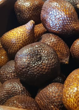 group of snake fruit or called salak in local indonesian language is a type of palm fruit commonly eaten also known as sala, the scientific name is Salacca zalacca.