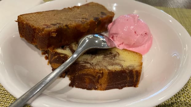 Fresh fruit cake and marble pound cake with strawberry ice cream on white plate for your multimedia backgrounds