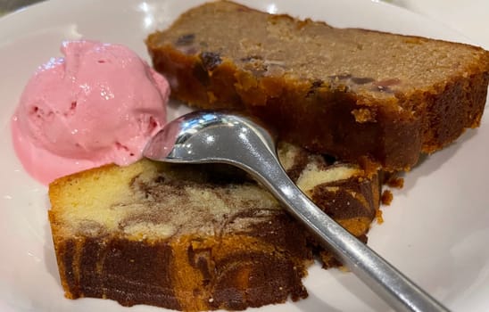 Fresh fruit cake and marble pound cake with strawberry ice cream on white plate for your multimedia backgrounds