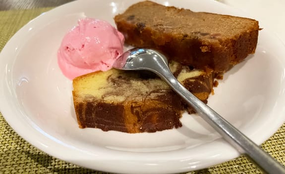 Fresh fruit cake and marble pound cake with strawberry ice cream on white plate for your multimedia backgrounds