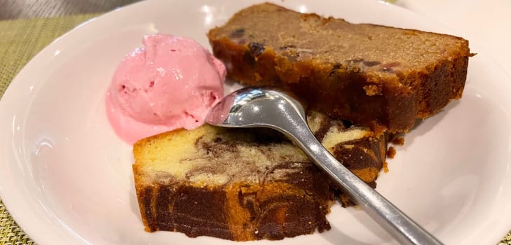 Fresh fruit cake and marble pound cake with strawberry ice cream on white plate for your multimedia backgrounds