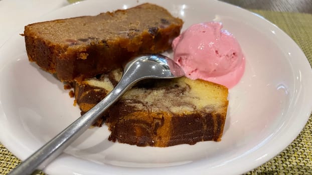 Fresh fruit cake and marble pound cake with strawberry ice cream on white plate for your multimedia backgrounds