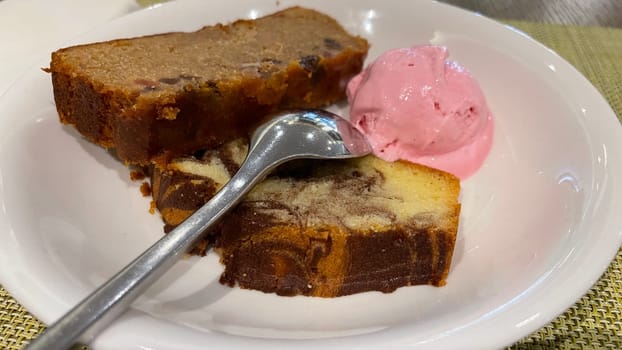 Fresh fruit cake and marble pound cake with strawberry ice cream on white plate for your multimedia backgrounds