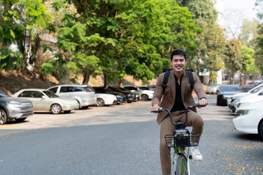 The businessman eco friendly transportation, cycling through the city avenues to go to work. sustainable lifestyle concept.
