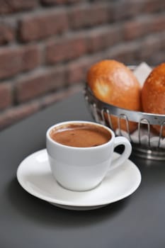 a cup of turkish coffee on table .