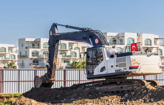 Close up details of industrial excavator working on construction site